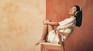 side-view-of-asian-girl-sitting-on-chair-enjoying-2024-10-18-05-28-22-utc